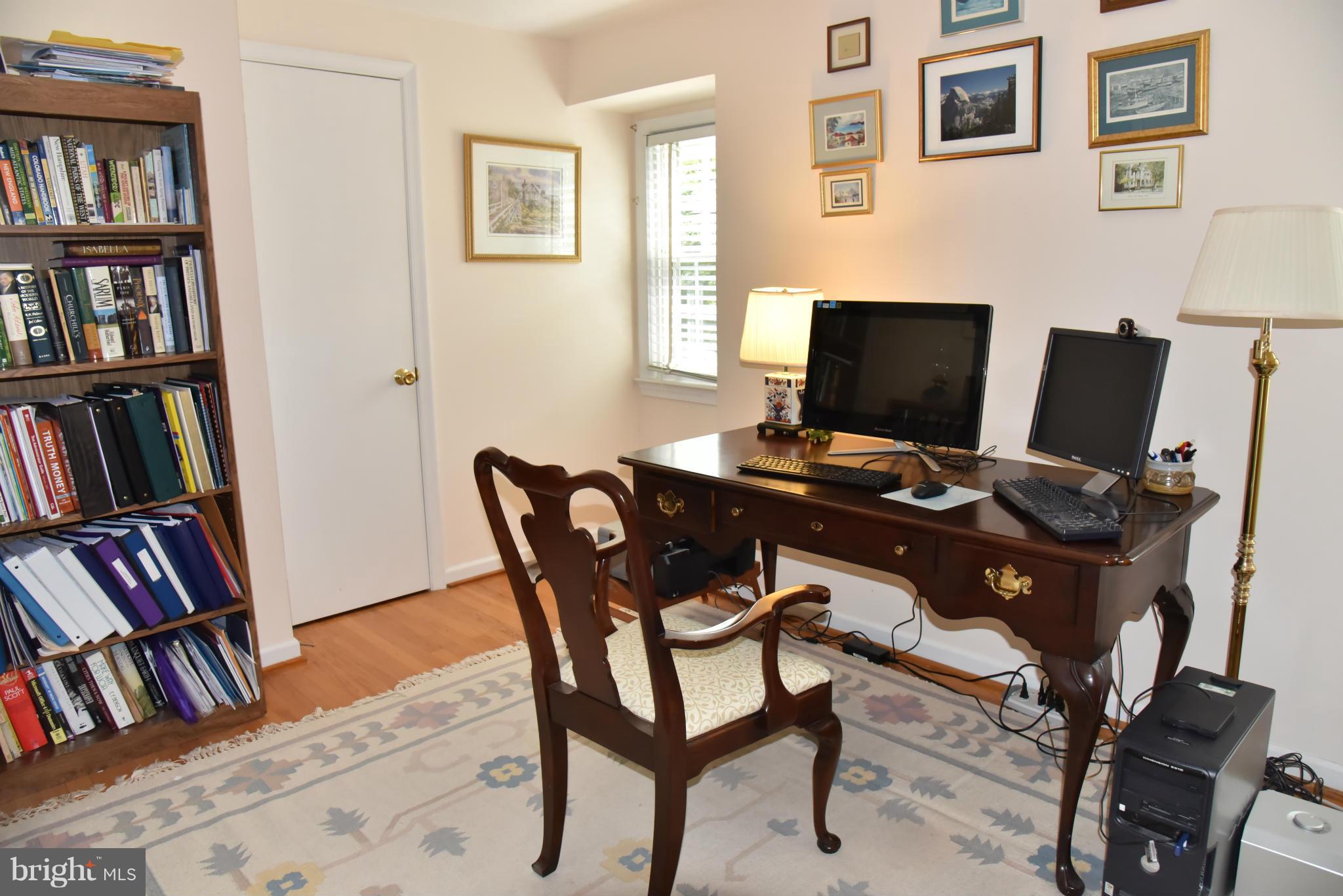 3821 King Arthur Road Annandale, VA 22003 - Photo 10 of 30 a view of a workspace with bookshelf and a window