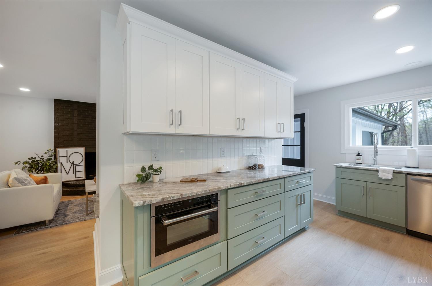 1761 Old Farm Road Lynchburg, VA 24503 - Photo 11 of 60 a kitchen with stainless steel appliances granite countertop a sink and dishwasher a stove with wooden floor