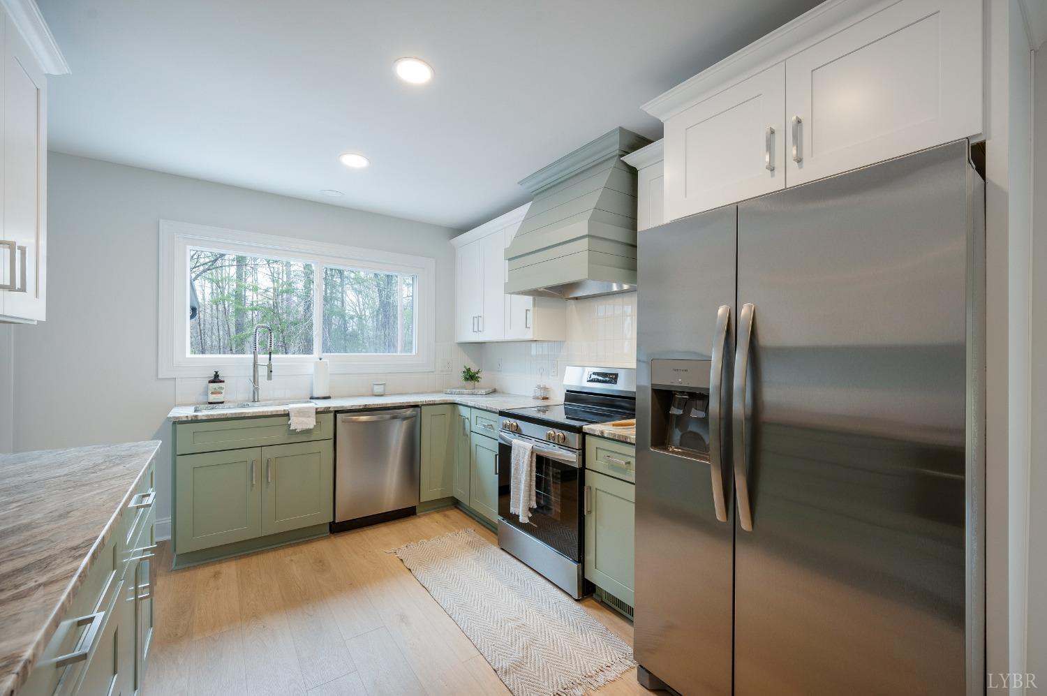 1761 Old Farm Road Lynchburg, VA 24503 - Photo 12 of 60 a kitchen with stainless steel appliances granite countertop a refrigerator and a sink