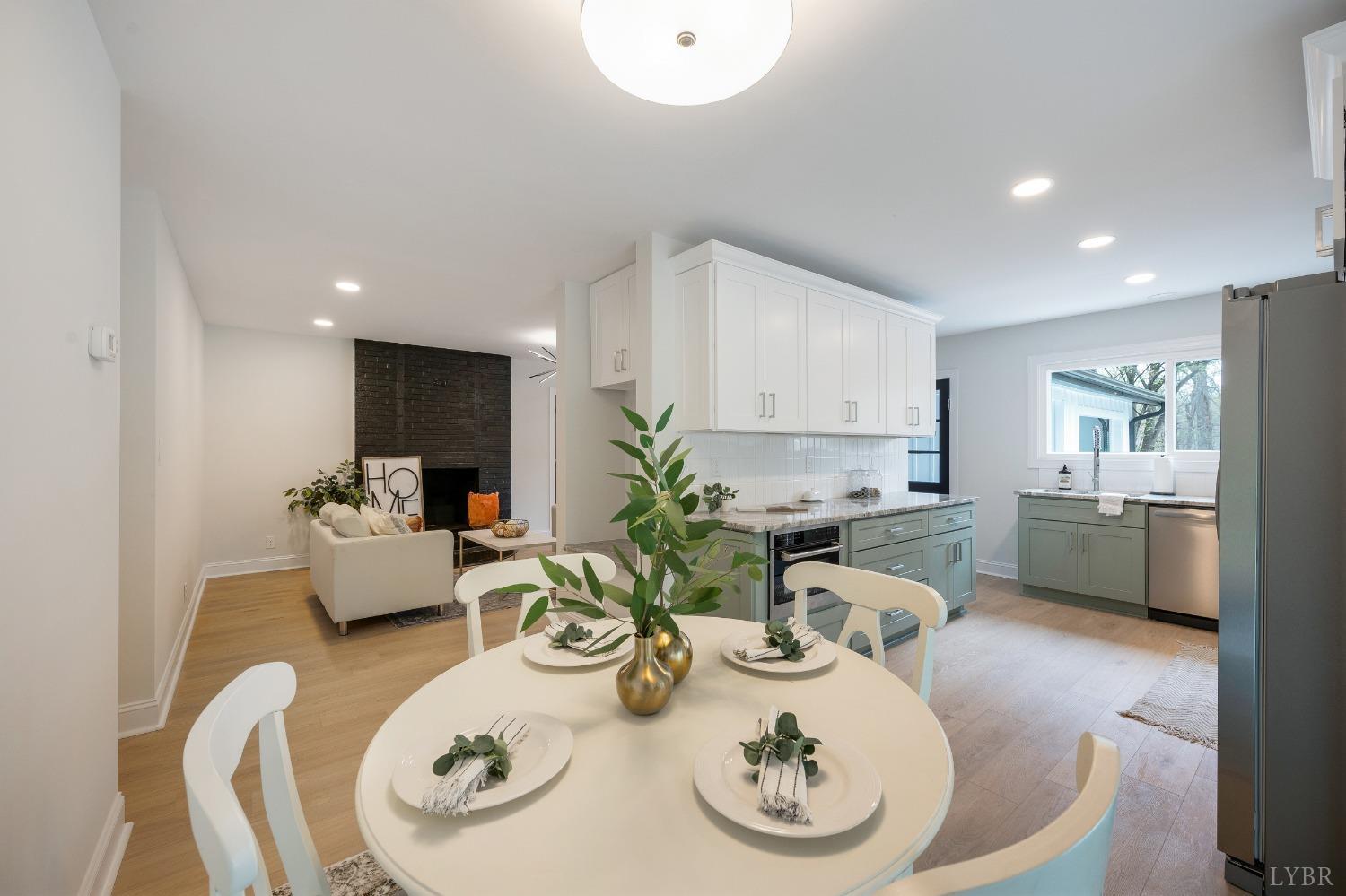 1761 Old Farm Road Lynchburg, VA 24503 - Photo 19 of 60 a kitchen with stainless steel appliances kitchen island granite countertop a sink and wooden floor
