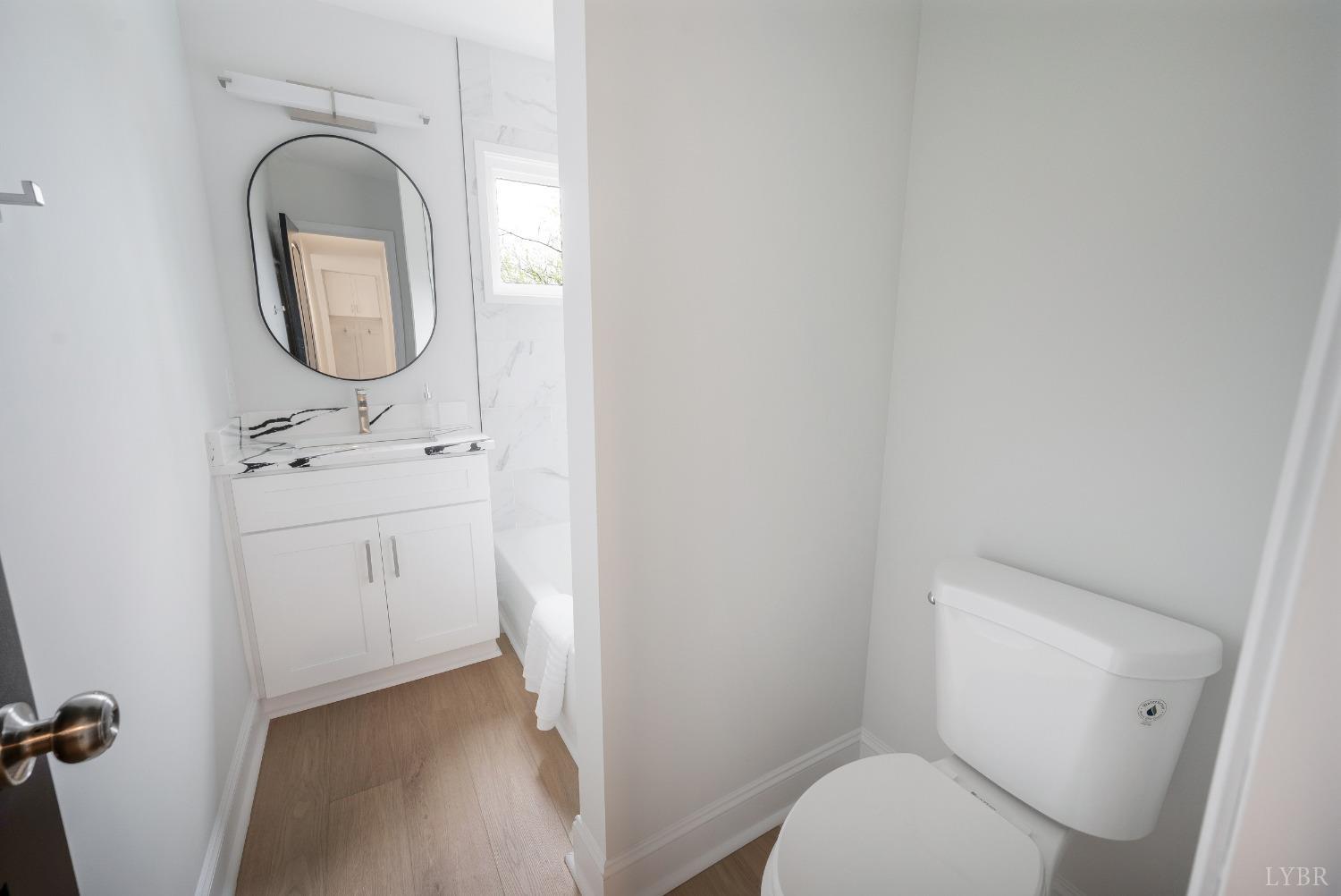 1761 Old Farm Road Lynchburg, VA 24503 - Photo 20 of 60 a white toilet sitting next to a bathroom sink