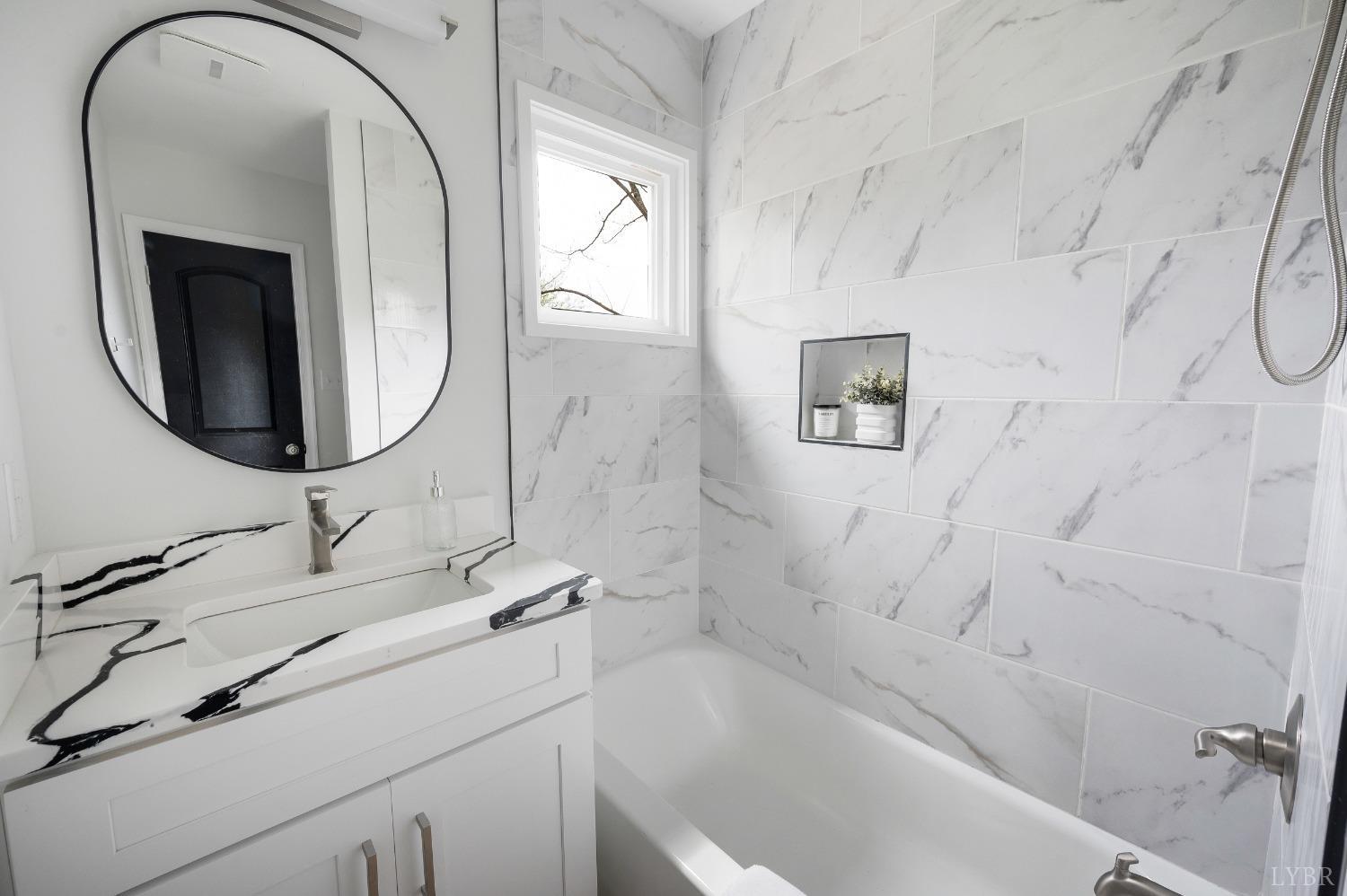 1761 Old Farm Road Lynchburg, VA 24503 - Photo 21 of 60 a bathroom with a sink and a mirror