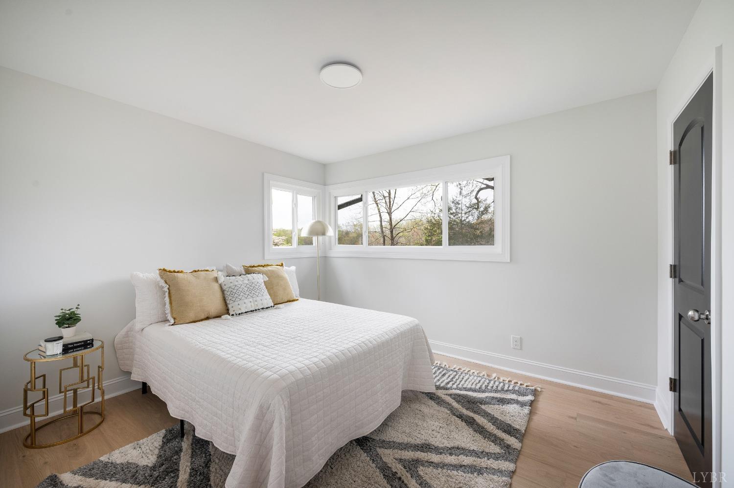 1761 Old Farm Road Lynchburg, VA 24503 - Photo 22 of 60 a bedroom with a bed and wooden floor