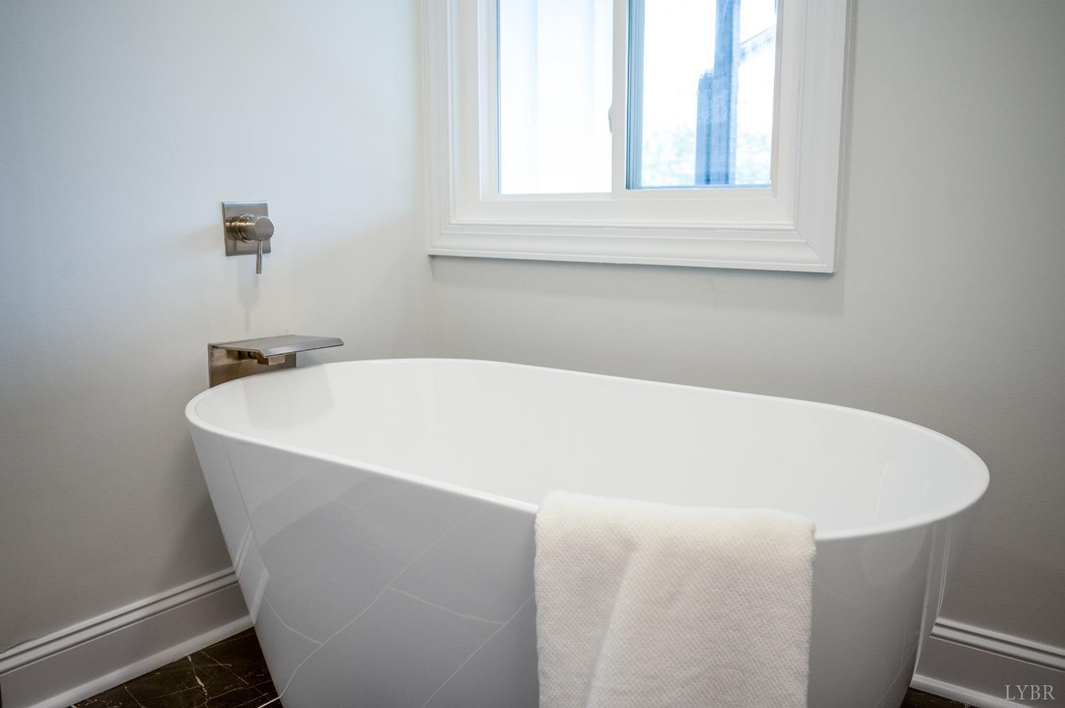 1761 Old Farm Road Lynchburg, VA 24503 - Photo 30 of 60 a white bath tub sitting in a bathroom