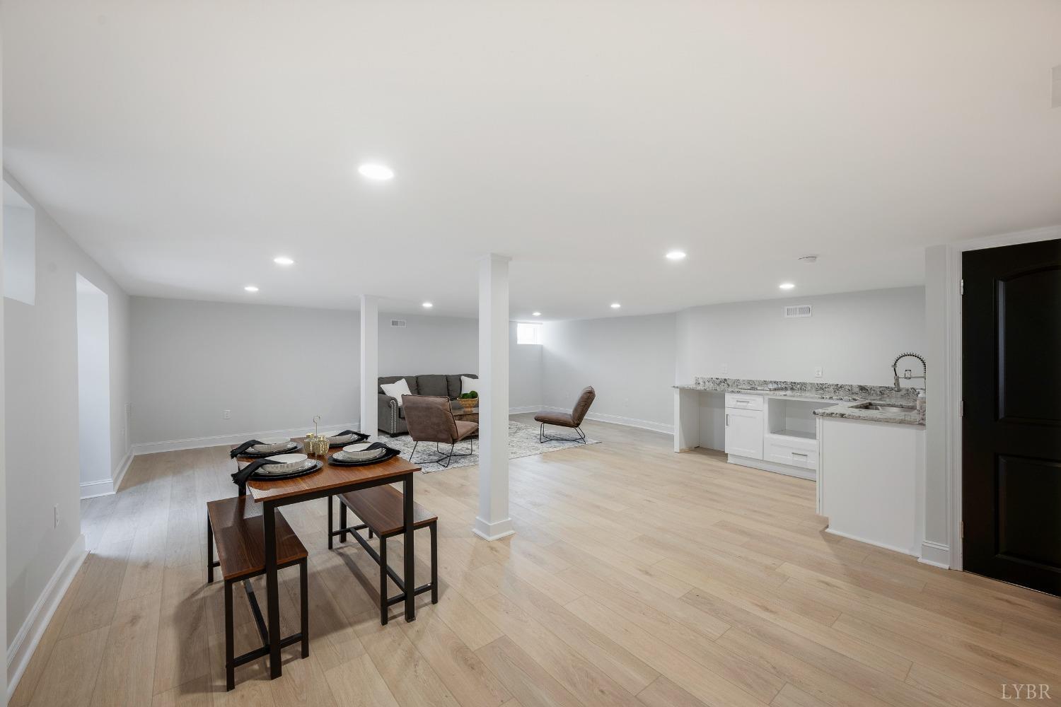 1761 Old Farm Road Lynchburg, VA 24503 - Photo 36 of 60 a view of a kitchen with kitchen island a stove a refrigerator a table and chairs