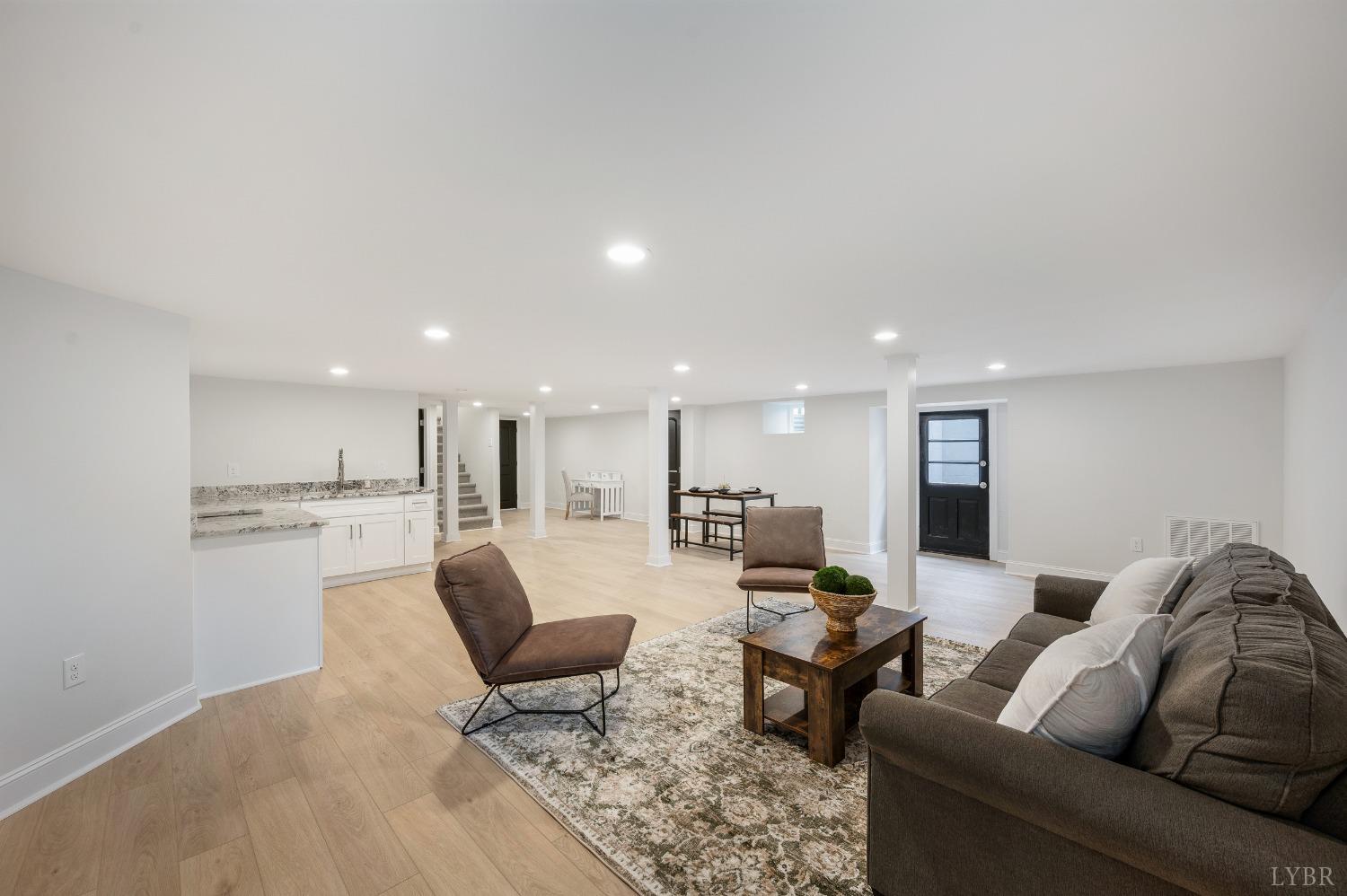 1761 Old Farm Road Lynchburg, VA 24503 - Photo 37 of 60 a living room with furniture white walls and kitchen view