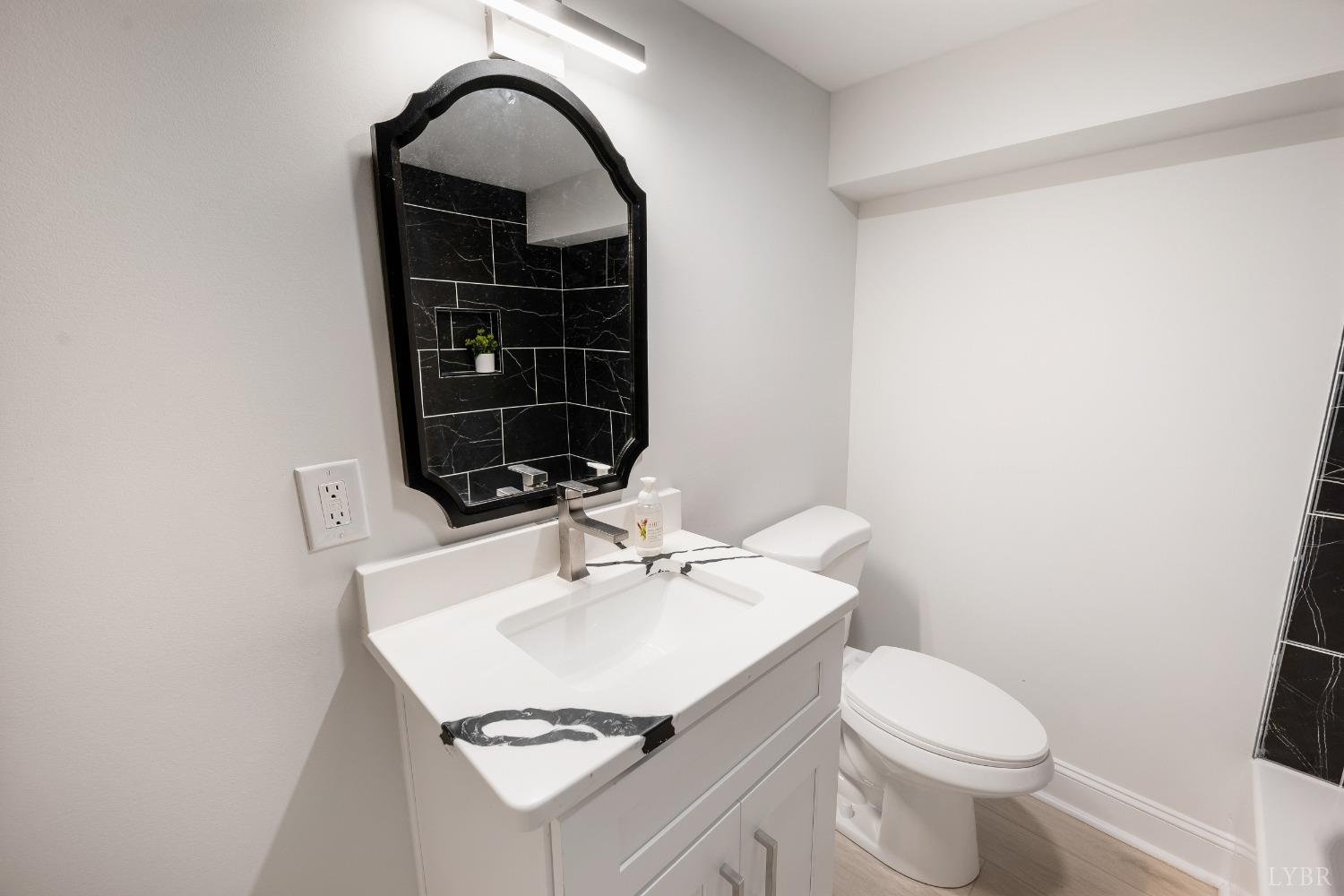 1761 Old Farm Road Lynchburg, VA 24503 - Photo 40 of 60 a bathroom with a sink toilet and mirror