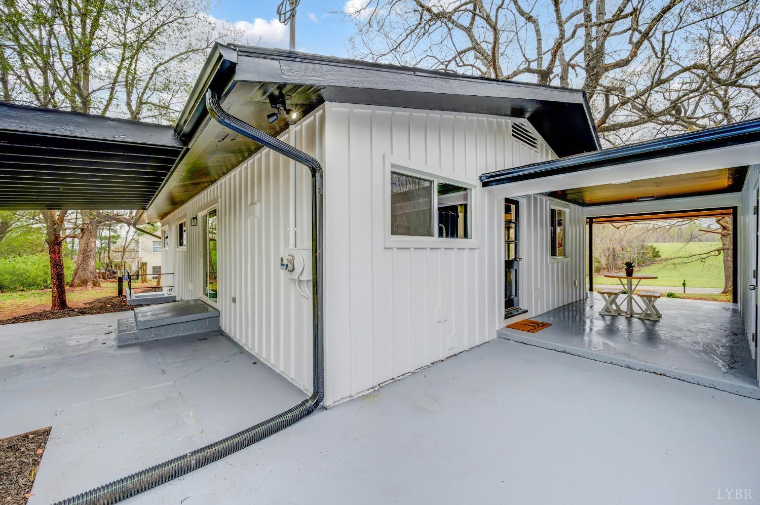 1761 Old Farm Road Lynchburg, VA 24503 - Photo 52 of 60 a view of a porch with furniture and a garage
