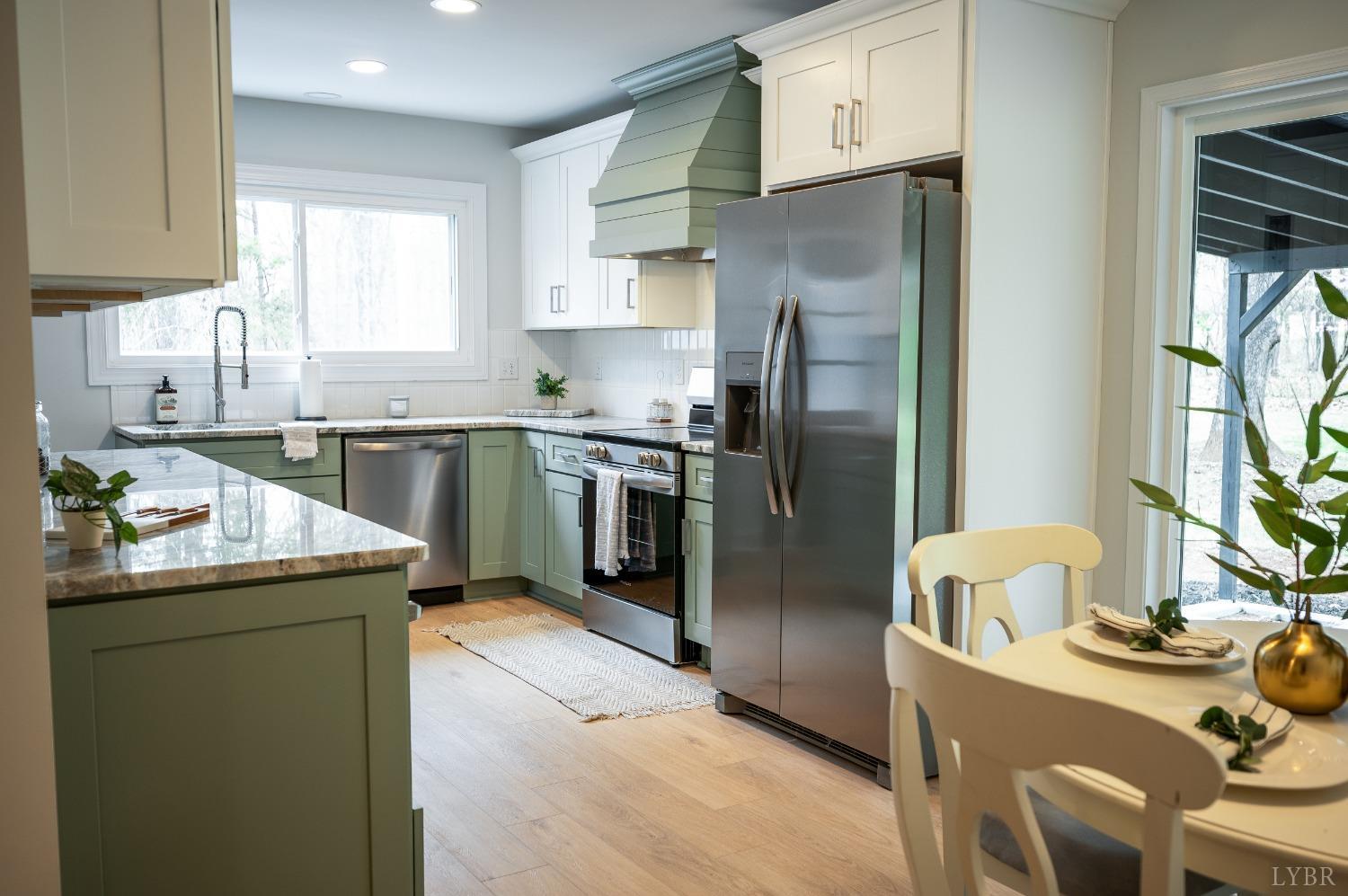 1761 Old Farm Road Lynchburg, VA 24503 - Photo 10 of 60 a kitchen with stainless steel appliances granite countertop a sink stove and refrigerator
