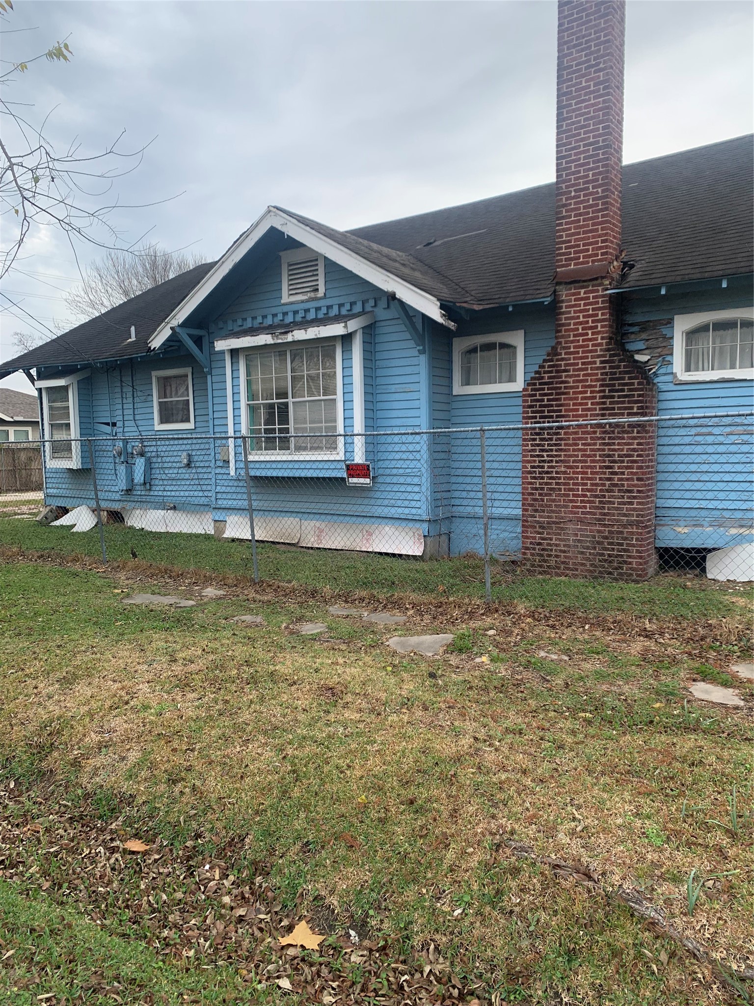5001 Sherman Street Houston, TX 77011 - Photo 2 of 23 a front view of a house with a yard