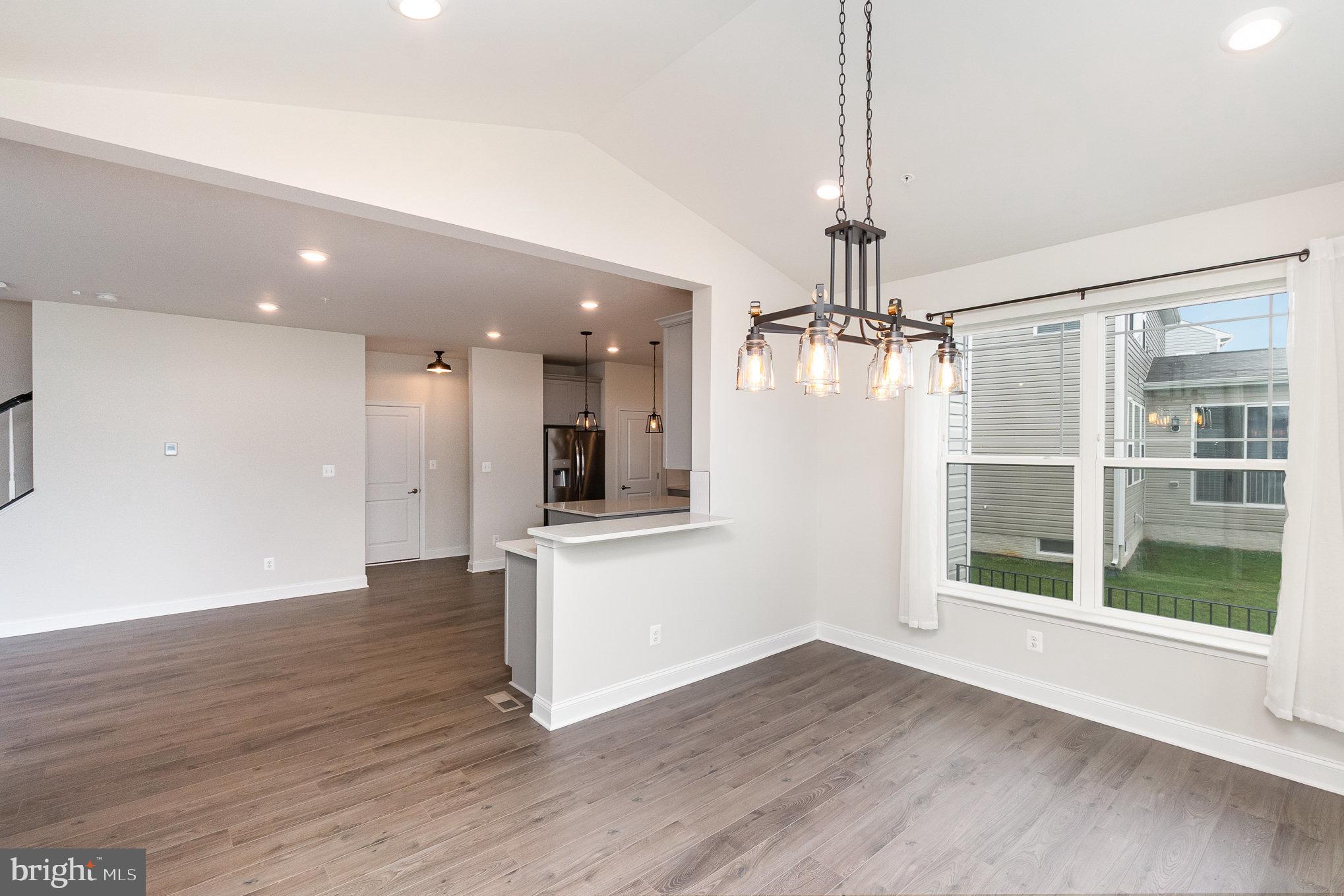 1126 Up And Over Lane Aberdeen, MD 21001 - Photo 15 of 46 a view of empty room with wooden floor and windows