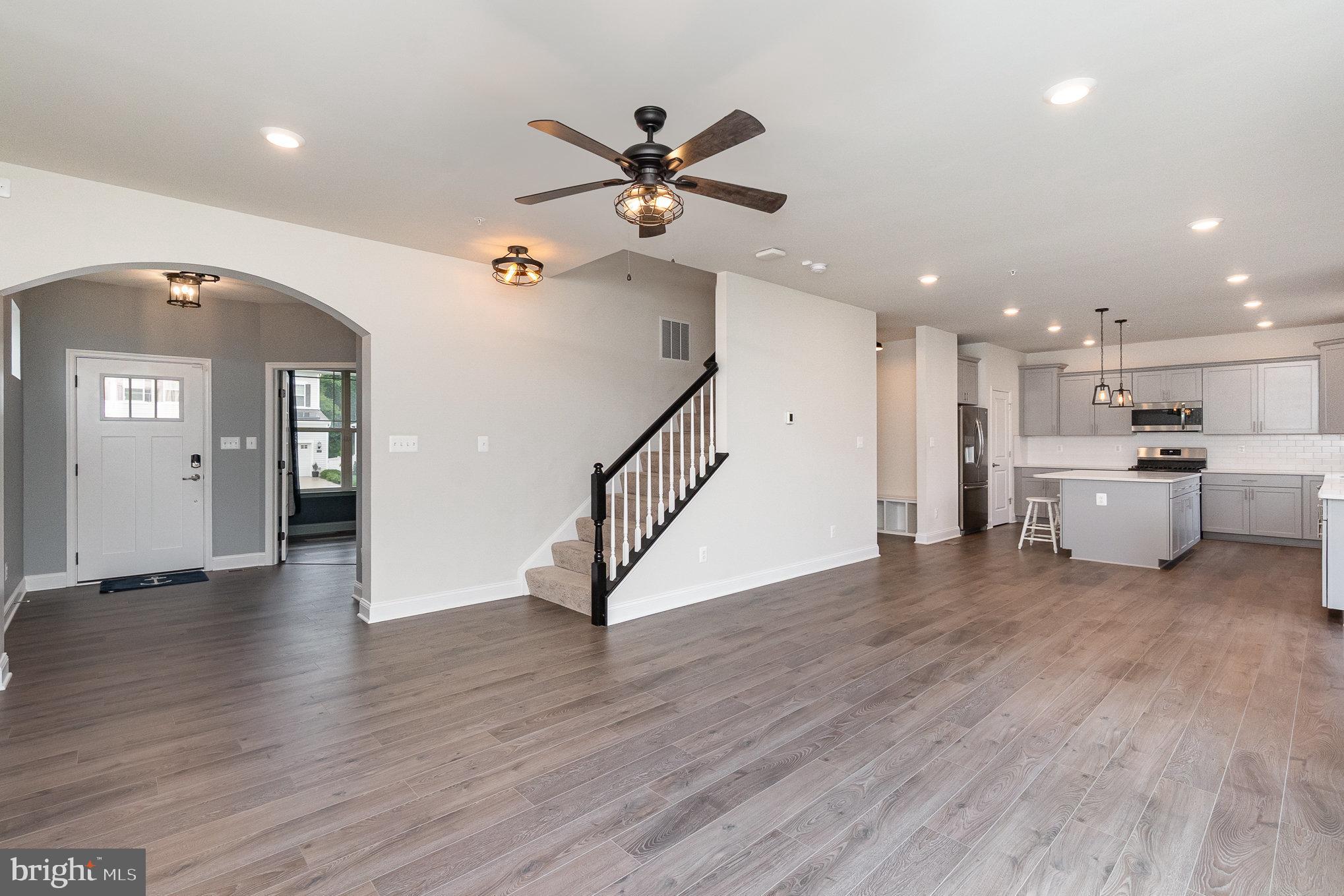 1126 Up And Over Lane Aberdeen, MD 21001 - Photo 17 of 46 a view of a livingroom with wooden floor and staircase