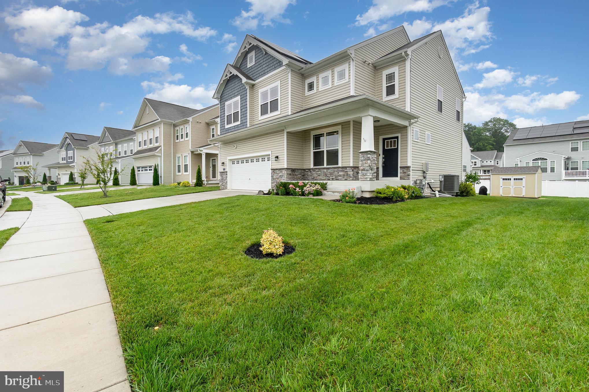 1126 Up And Over Lane Aberdeen, MD 21001 - Photo 2 of 46 a view of a white house with a big yard and large trees