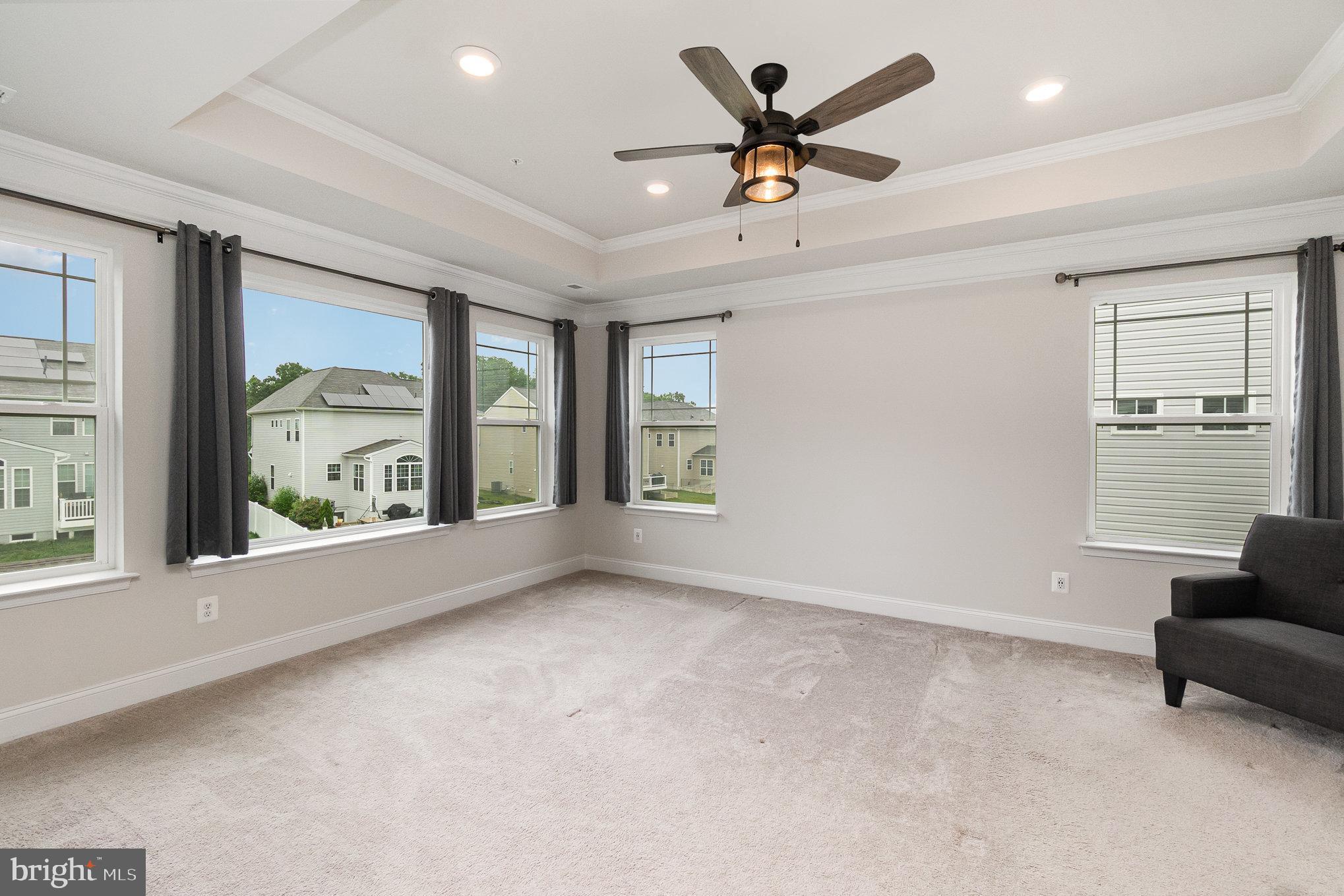 1126 Up And Over Lane Aberdeen, MD 21001 - Photo 22 of 46 an empty room with windows and ceiling fan