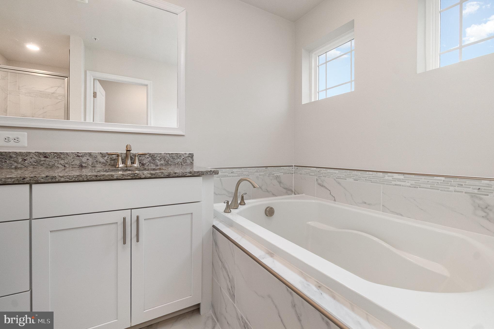 1126 Up And Over Lane Aberdeen, MD 21001 - Photo 27 of 46 a bathroom with a bathtub and a sink