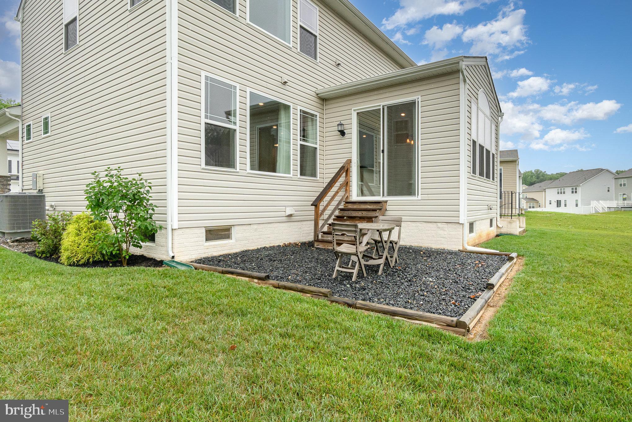 1126 Up And Over Lane Aberdeen, MD 21001 - Photo 42 of 46 a front view of house with backyard and outdoor seating