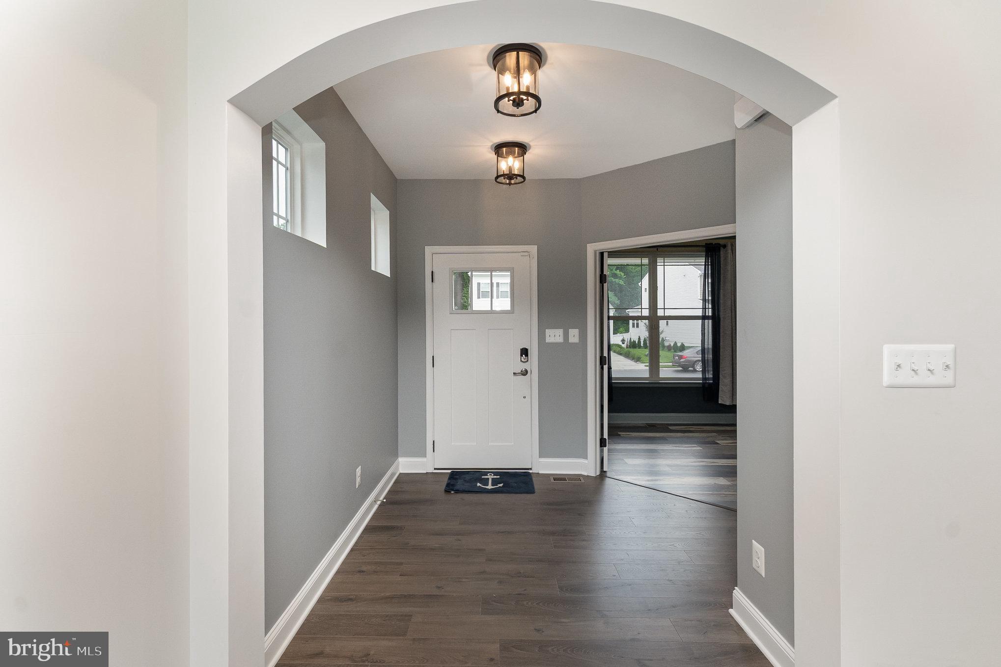 1126 Up And Over Lane Aberdeen, MD 21001 - Photo 6 of 46 a view of a hallway with wooden floor and a bathroom