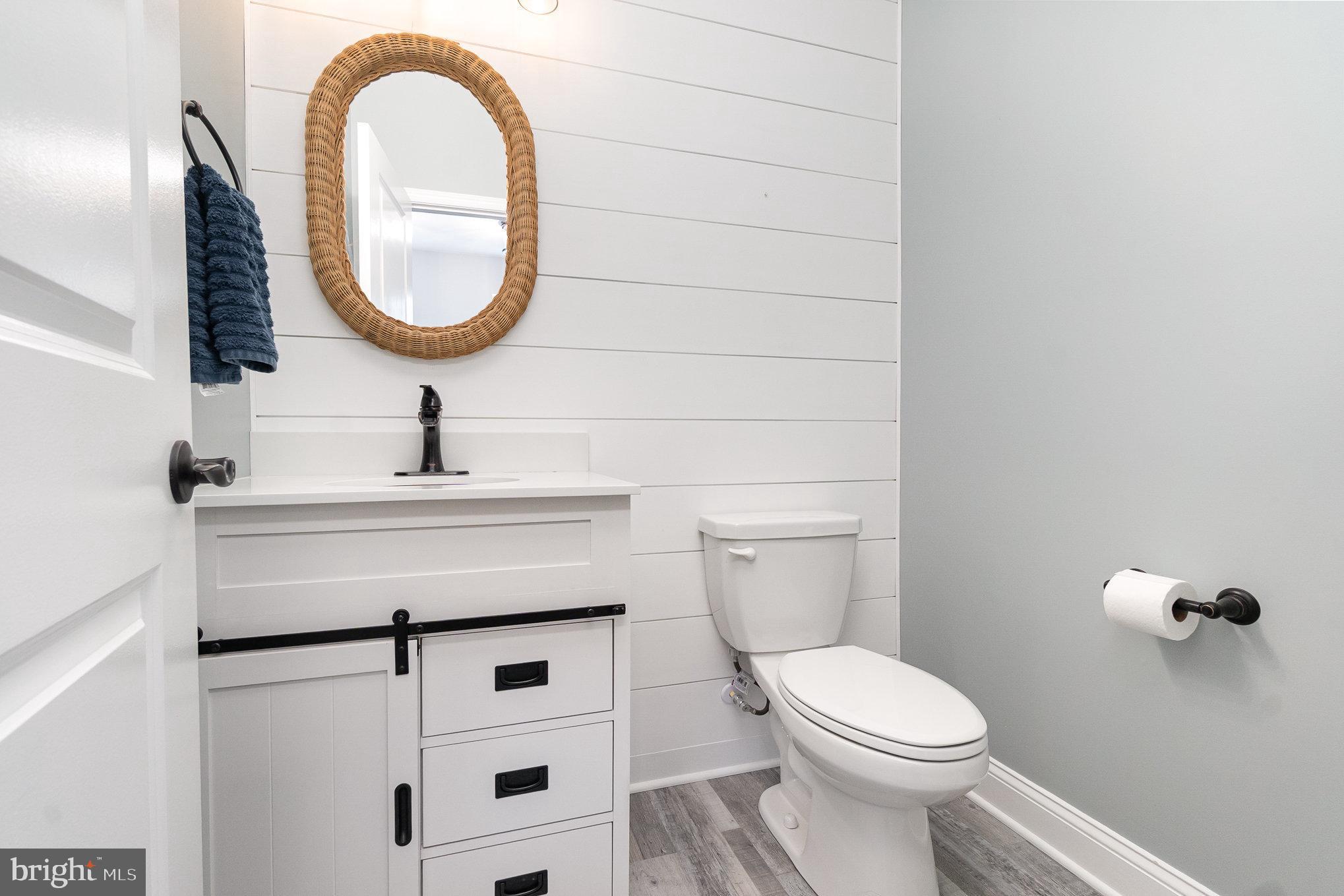 1126 Up And Over Lane Aberdeen, MD 21001 - Photo 7 of 46 a bathroom with a sink a toilet and a mirror