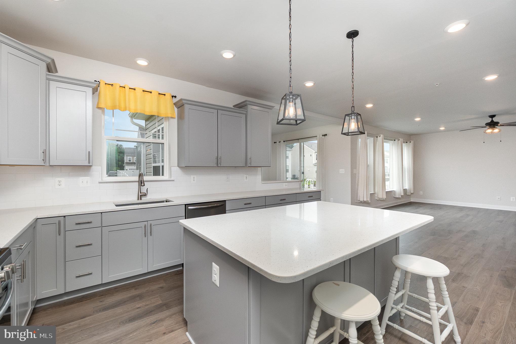 1126 Up And Over Lane Aberdeen, MD 21001 - Photo 8 of 46 a kitchen with a table chairs sink and cabinets