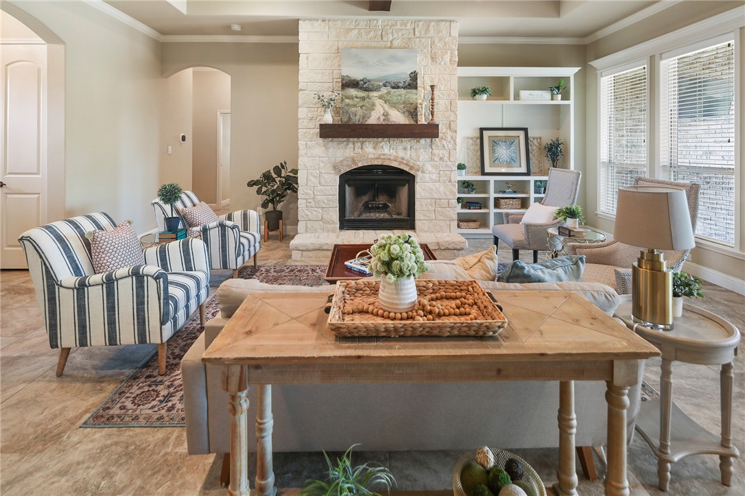 3204 Ashville Path Bryan, TX 77808 - Photo 1 of 1 a living room with furniture and a fireplace