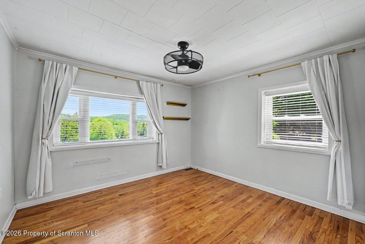 457 Craig Road Dalton, PA 18414 - Photo 67 of 114 a view of a livingroom with wooden floor and a window