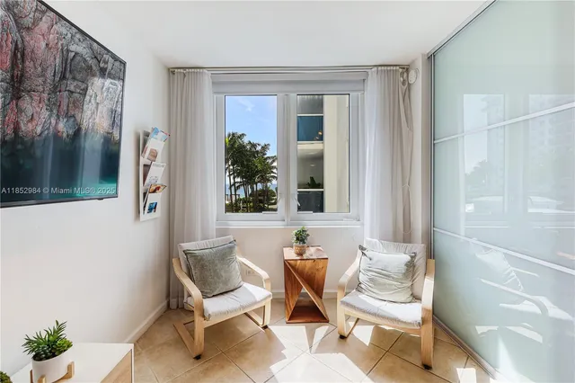 a view of a entryway with furniture and front door