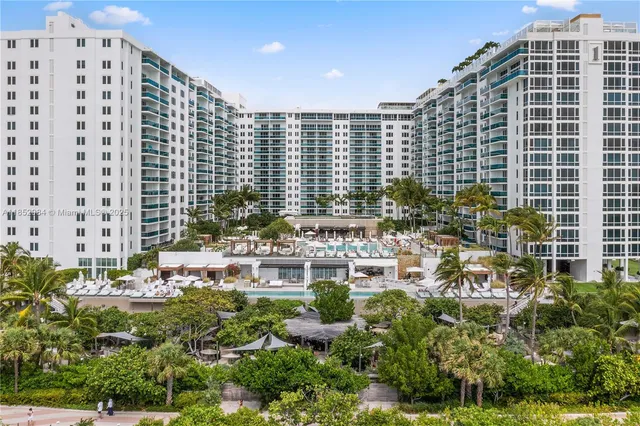 a view of building with outdoor space and garden