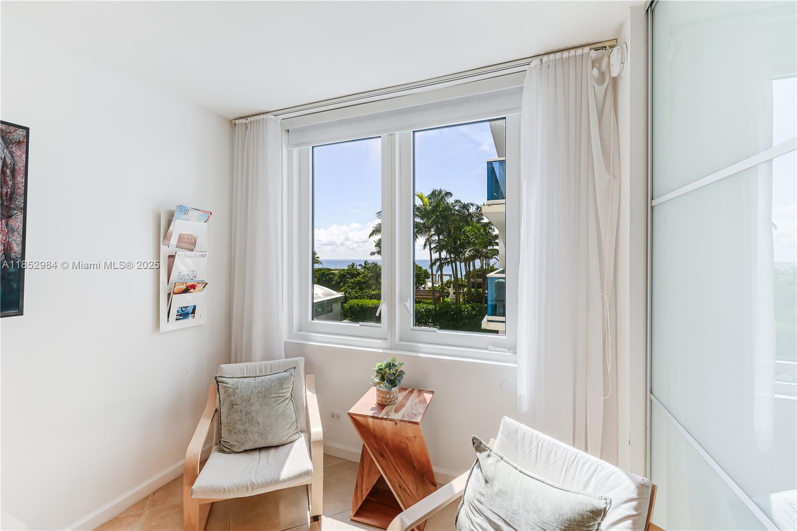 2301 Collins Avenue, Unit 523 Miami Beach, FL 33139 - Photo 30 of 49 a living room with furniture and a window