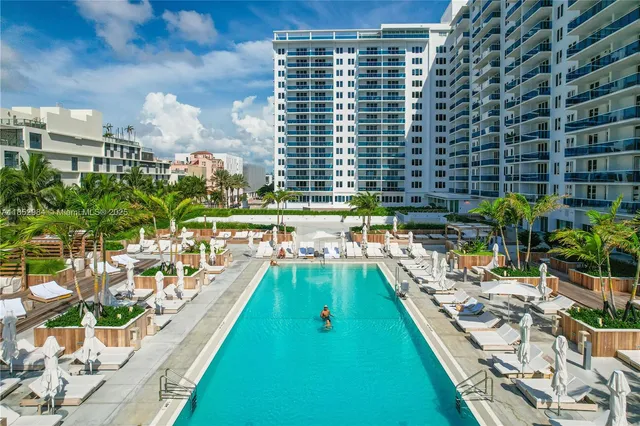 a view of a swimming pool with a patio