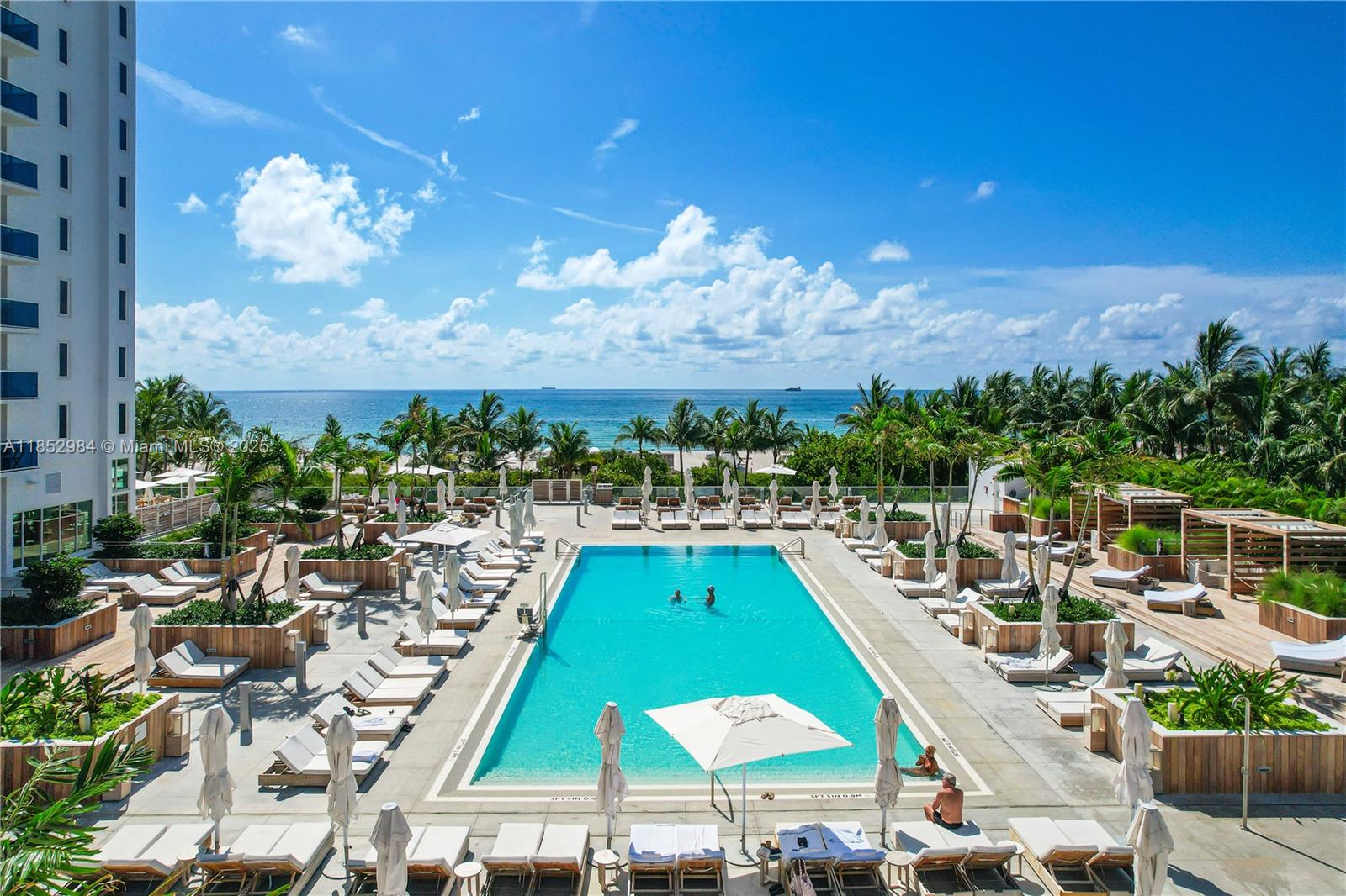 2301 Collins Avenue, Unit 523 Miami Beach, FL 33139 - Photo 39 of 49 a view of a swimming pool patio and outdoor seating