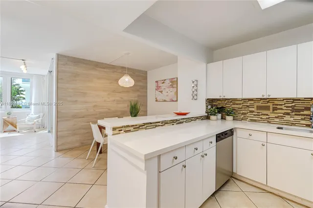a kitchen with a stove and a refrigerator