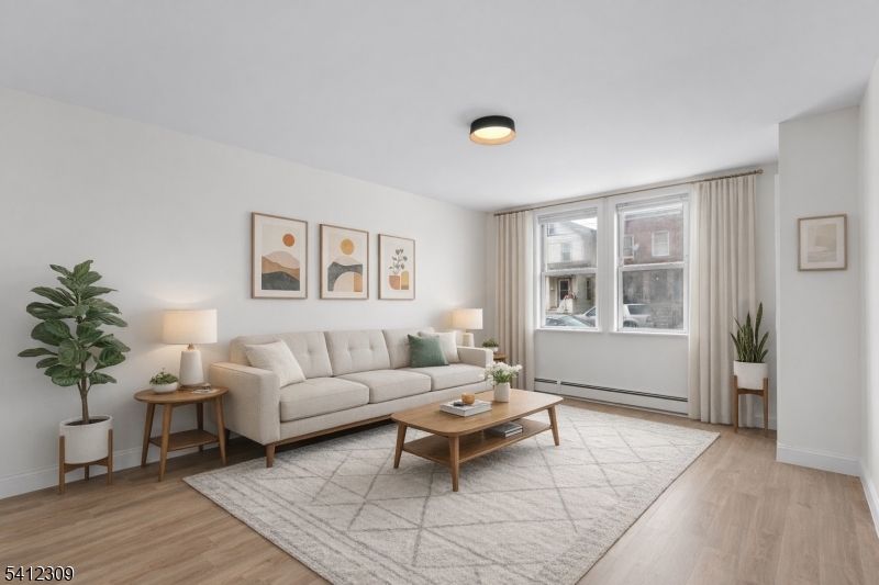 a living room with furniture and window