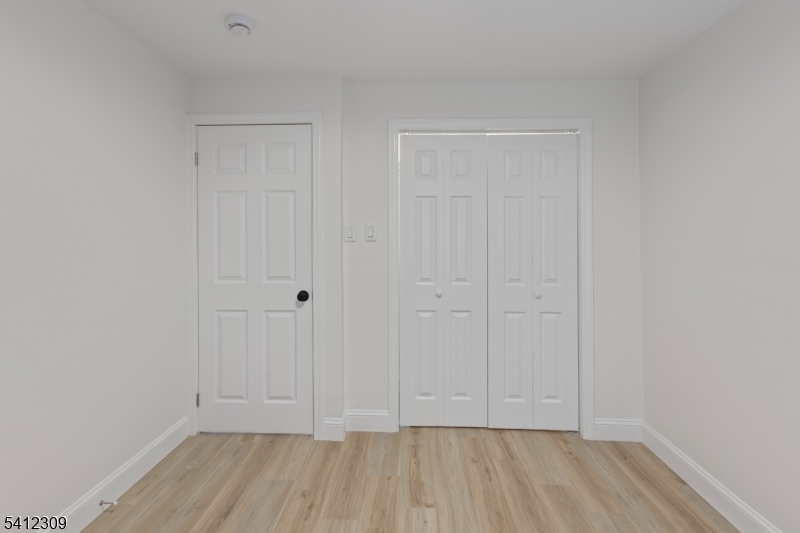 676 Chestnut Street, Unit 1 Kearny, NJ 07032 - Photo 14 of 27 a view of room with hardwood floor