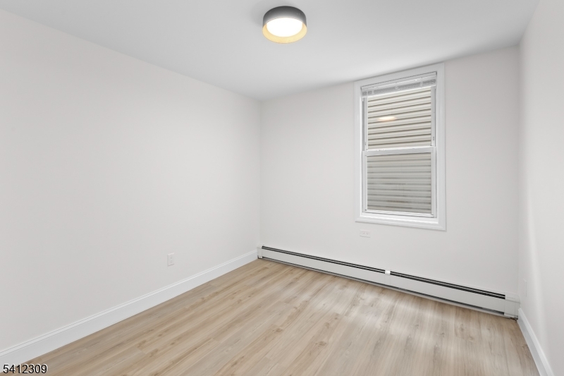 676 Chestnut Street, Unit 1 Kearny, NJ 07032 - Photo 16 of 27 an empty room with a window
