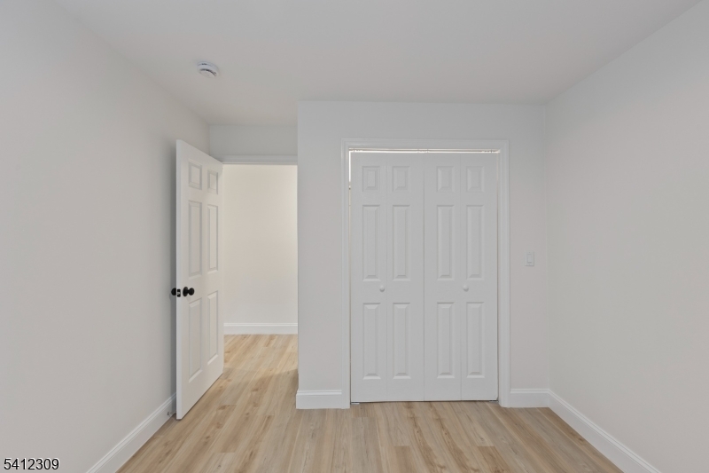 676 Chestnut Street, Unit 1 Kearny, NJ 07032 - Photo 17 of 27 a view of a room with wooden floor