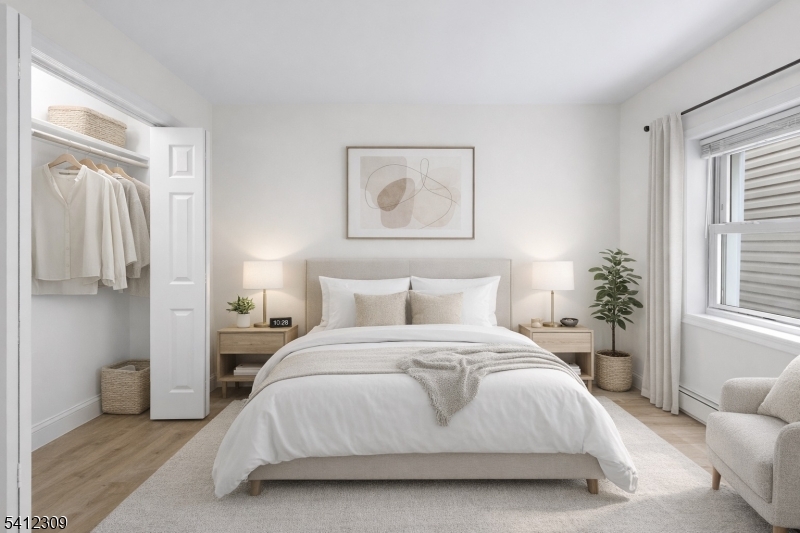 676 Chestnut Street, Unit 1 Kearny, NJ 07032 - Photo 2 of 27 a bedroom with a bed and a couch