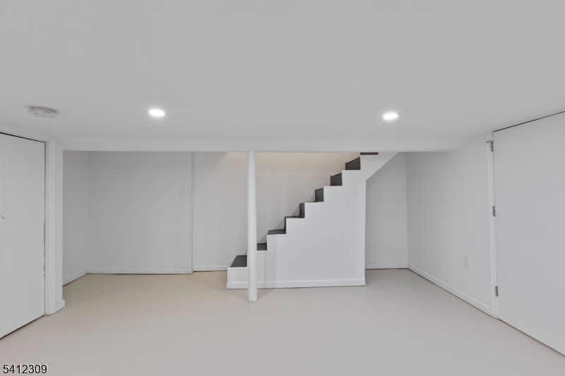 676 Chestnut Street, Unit 1 Kearny, NJ 07032 - Photo 23 of 27 a view of staircase with white walls