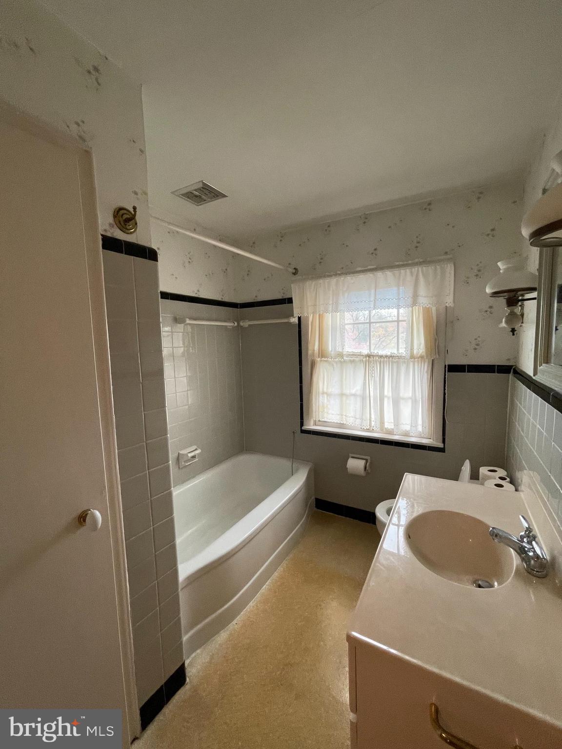 435 Sycamore Road Reading, PA 19611 - Photo 14 of 14 a bathroom with a sink a bathtub and a sink