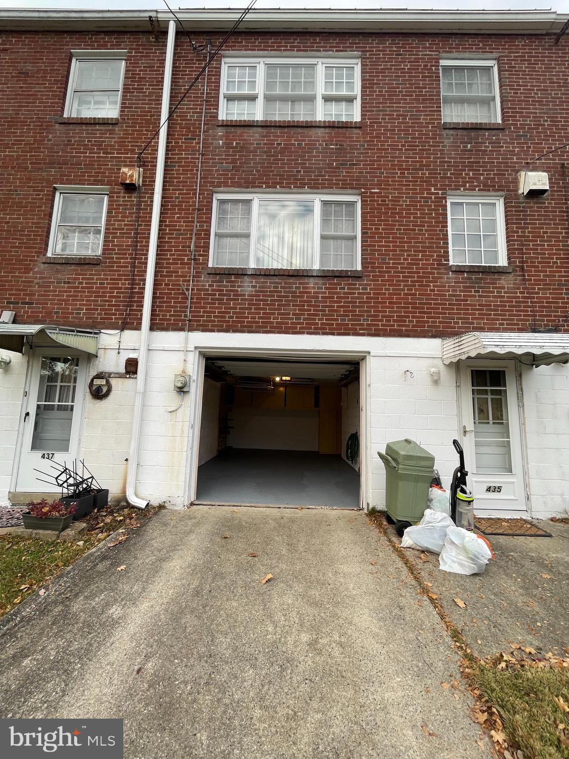 435 Sycamore Road Reading, PA 19611 - Photo 2 of 14 a view of a brick house with many windows