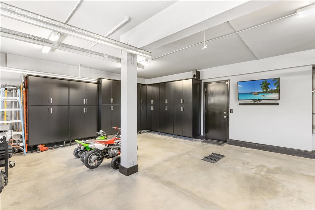 1865 Duncan Way Corona, CA 92881 - Photo 30 of 46 Upgraded Finished 3-Car Garage with Lots of Cabinet Storage on Both Sides of Garage, plus Attic Storage.