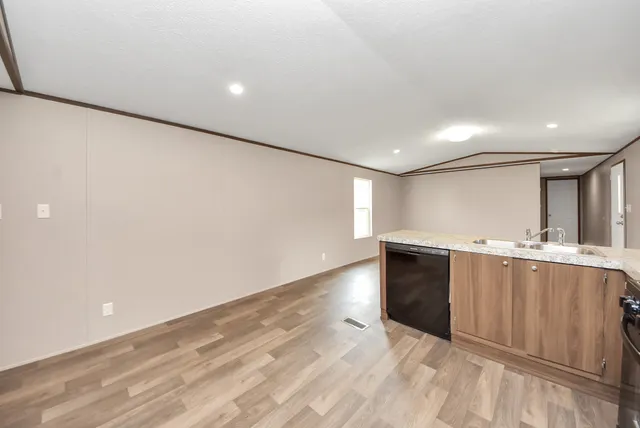 a view of kitchen with cabinets