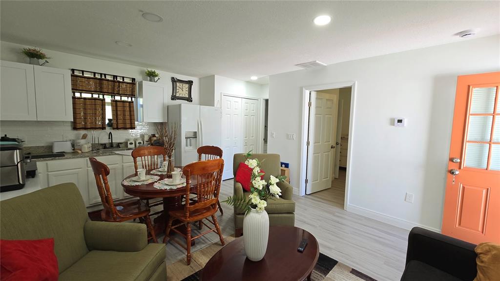 2207 Julianna Court St. Cloud, FL 34769 - Photo 6 of 11 a living room with furniture and wooden floor