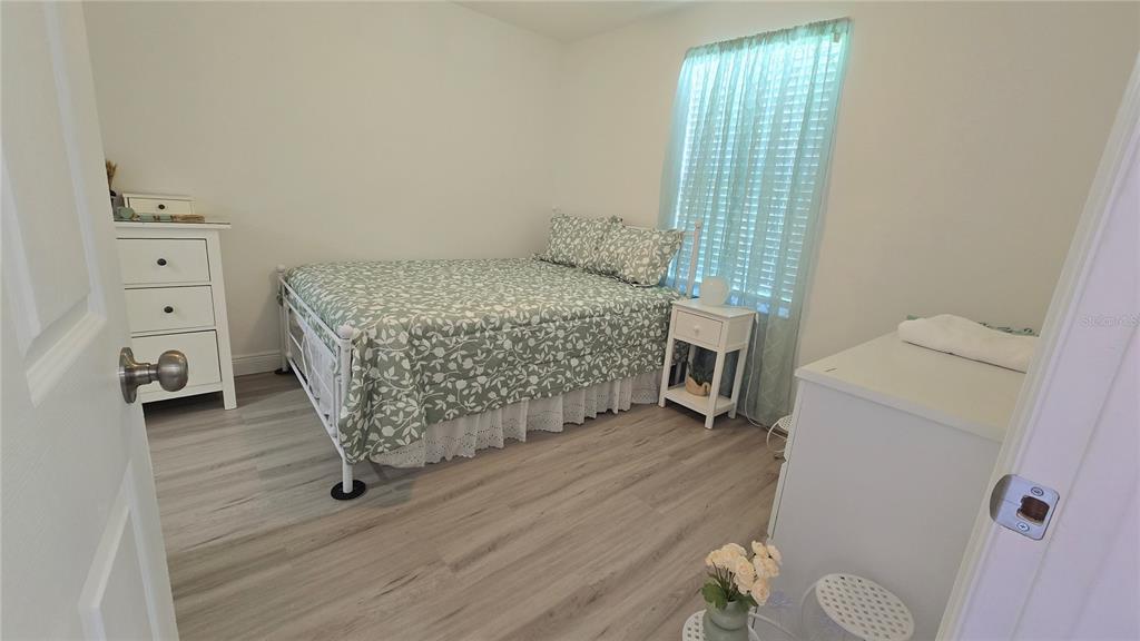 2207 Julianna Court St. Cloud, FL 34769 - Photo 7 of 11 a living room with furniture and a wooden floor