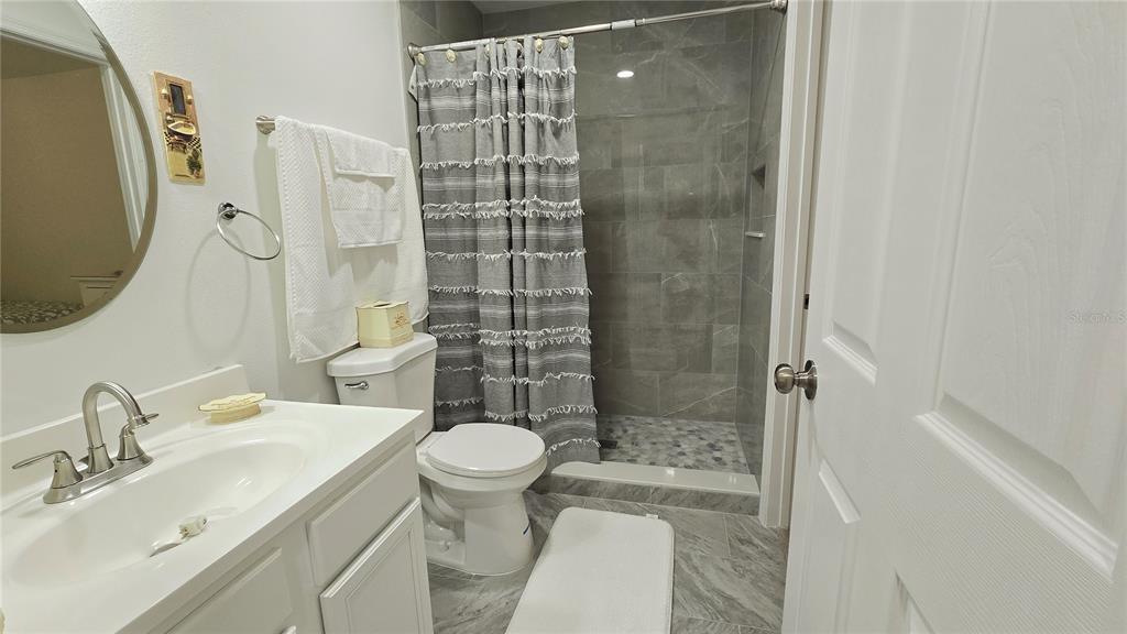 2207 Julianna Court St. Cloud, FL 34769 - Photo 9 of 11 a bathroom with a sink toilet and shower