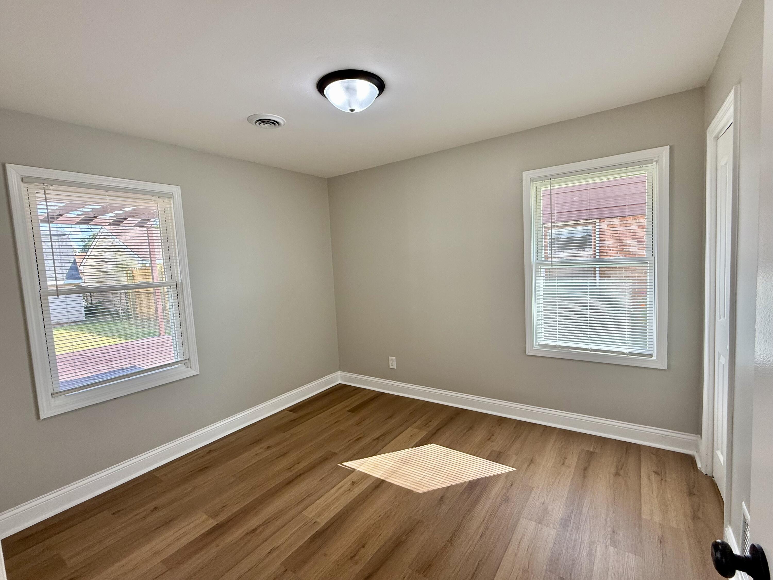539 North Raymond Street Griffith, IN 46319 - Photo 11 of 24 a view of a room with wooden floor and windows
