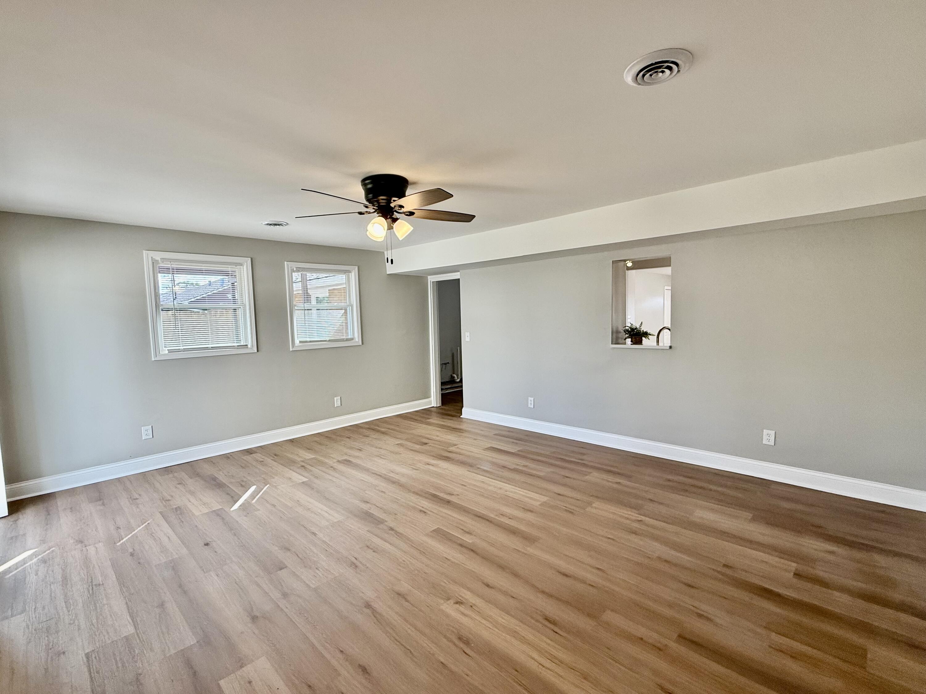 539 North Raymond Street Griffith, IN 46319 - Photo 15 of 24 a view of an empty room with wooden floor and a window