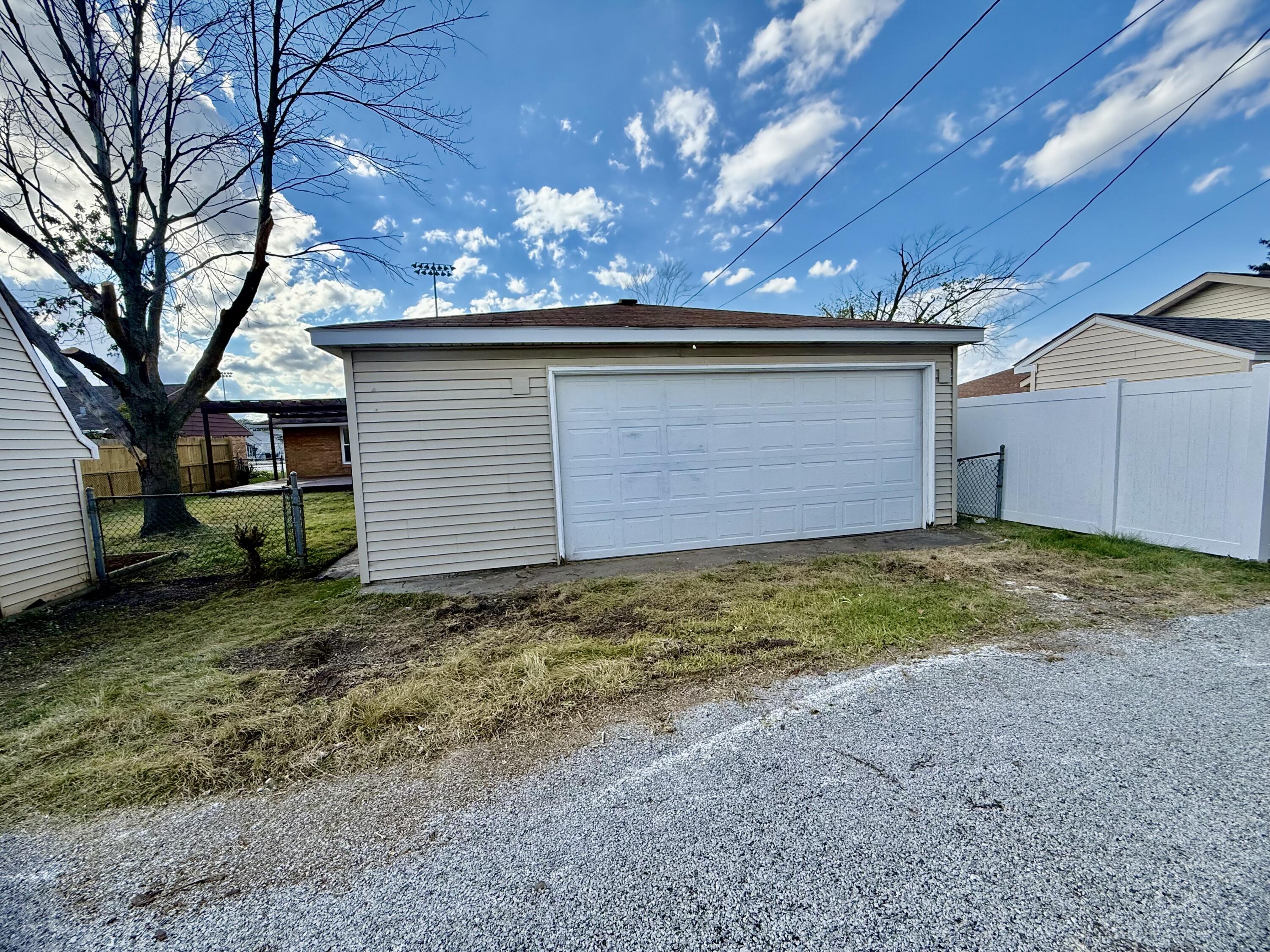 539 North Raymond Street Griffith, IN 46319 - Photo 21 of 24 a view of a house with a garage
