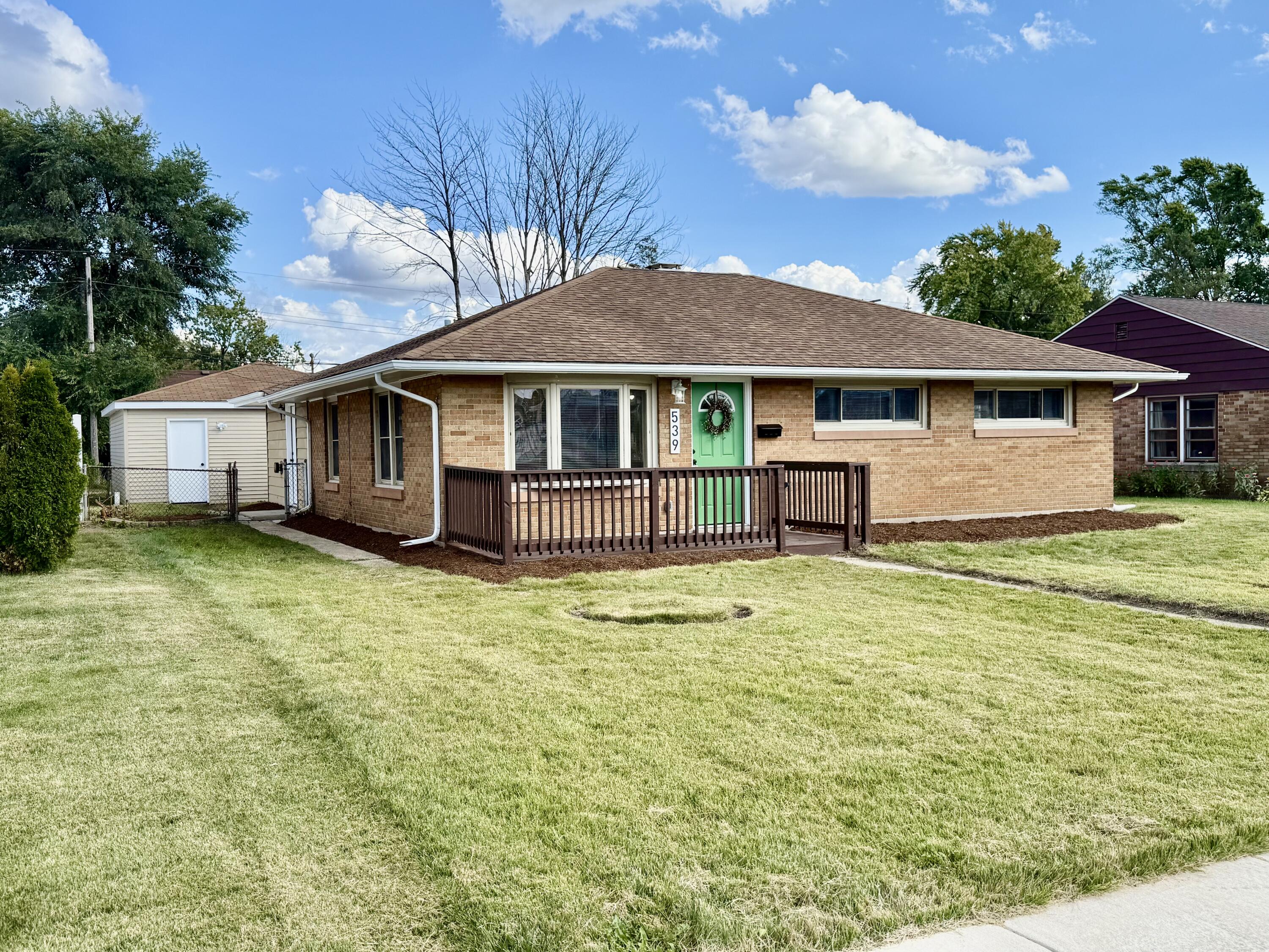 539 North Raymond Street Griffith, IN 46319 - Photo 23 of 24 a front view of a house with a garden