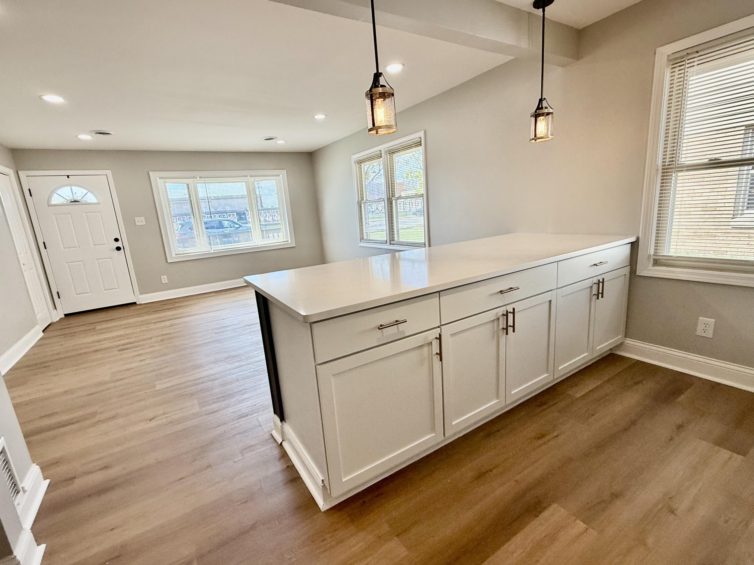 539 North Raymond Street Griffith, IN 46319 - Photo 6 of 24 a view of a kitchen with wooden floor