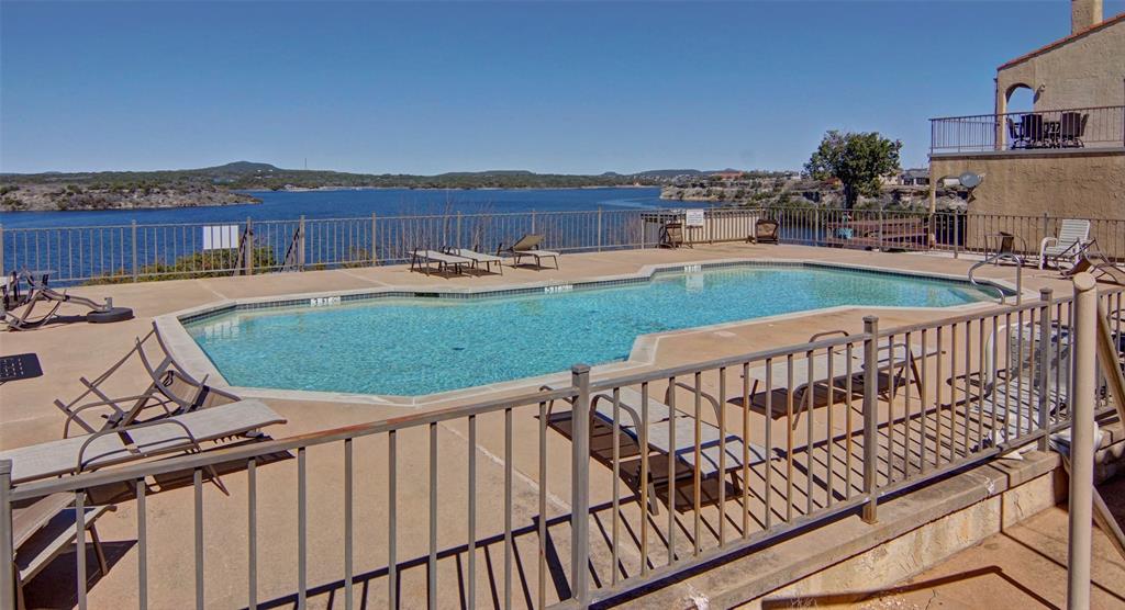 3109 Hells Gate Loop, Unit 59 Strawn, TX 76475 - Photo 24 of 25 a view of a balcony with a garden